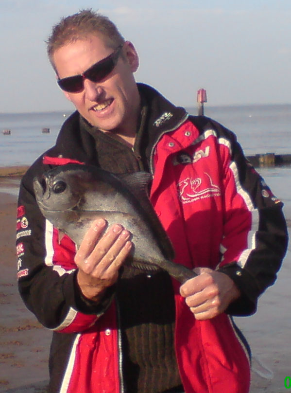 Chris Holden with the Ray's Bream on Cleethorpes beach